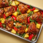 Hawaiian Chicken Sheet Pan Dinner with colorful vegetables and tropical ingredients.