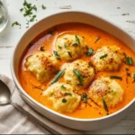 Delicious tomato soup with cheddar bay dumplings served in a bowl