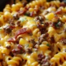 Bacon Cheeseburger Pasta dish topped with bacon and cheese