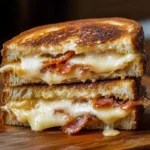 Delicious Bacon Grilled Cheese Sandwich with crispy bacon and melted cheese.