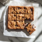 Delicious chewy blondies with a golden-brown crust and a soft, gooey center.
