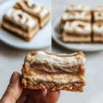 Freshly baked cinnamon roll blondies with icing drizzled on top.