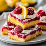 Delicious Lemon Raspberry Bars with vibrant lemon and raspberry toppings