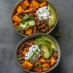 Delicious sweet potato taco bowl garnished with fresh vegetables and avocado