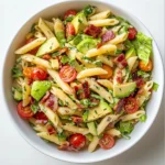 Delicious gluten free dairy free BLT pasta salad in a bowl with fresh ingredients.