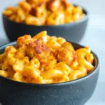 Buffalo Tofu Mac Cheese dish with creamy sauce and spicy flavors