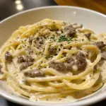 Creamy beef and garlic butter pasta served in a bowl