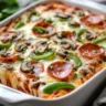Easy low carb pizza casserole topped with cheese and pepperoni.