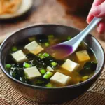 A bowl of easy homemade miso soup with green onions and tofu