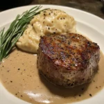 Delicious Filet Mignon steak served with creamy peppercorn sauce.
