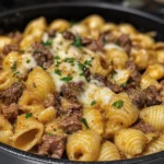 Delicious Garlic Butter Steak Bites served with creamy parmesan shells on a plate