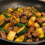 Healthy zucchini beef stir-fry with vibrant vegetables and savory beef.