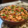 Delicious bowl of jambalaya filled with shrimp, sausage, and rice.