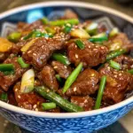 Plate of Mongolian Beef with veggies and rice meal.