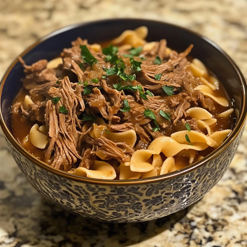 Slow Cooker Beef and Noodles dish with tender beef and hearty noodles in a bowl