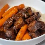 Delicious steak bites served on a platter with herbs and spices