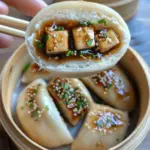 Delicious steamed vegan hoisin tofu buns served on a plate