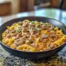 Easy 30-minute ground beef stroganoff served with pasta and garnished with parsley.