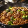 Delicious Beef and Broccoli Lo Mein served with fresh vegetables.