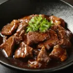 Beef fillet served with creamy pepper sauce on a plate