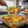 Big Mac Casserole served in a baking dish, showcasing layers of beef, cheese, and toppings.