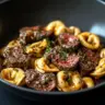 Delicious cracked garlic steak tortellini served in creamy sauce