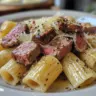 Creamy steak pasta with tender beef and rich sauce on a plate