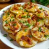 Crispy cheesy bacon potato slices topped with melted cheese and crispy bacon bits.