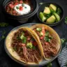 Crock pot Mexican shredded beef tacos served with fresh toppings