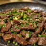 Plate of delicious Korean beef bulgogi with rice and vegetables