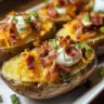 Delicious loaded baked potato with toppings like cheese, bacon, and sour cream