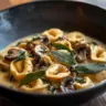 Sage Butter Pasta with Cheese Tortellini topped with fresh herbs and cheese.