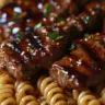 Delicious sticky honey garlic steak served with rotini pasta