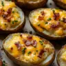 Delicious twice baked potatoes topped with cheese and herbs