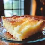 Delicious 4-ingredient lemon cream cheese dump cake served with lemon zest