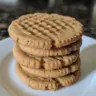 Plate of healthy peanut butter cookies served with a glass of milk