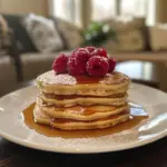 Delicious Greek yogurt pancakes stacked on a plate with fresh berries