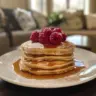 Delicious Greek yogurt pancakes stacked on a plate with fresh berries