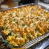 Cheesy broccoli chicken pasta bake served in a casserole dish