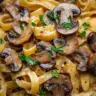 Creamy brown butter mushroom pasta topped with fresh herbs and cheese.