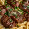 Creamy Garlic Parmesan Steak Pasta dish garnished with parsley.