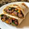 Delicious steak burritos filled with fresh vegetables and flavorful meat