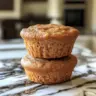 Delicious easy cinnamon protein muffins freshly baked in a muffin tin.