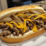 Delicious homemade easy classic Philly Cheesesteak sandwich with melted cheese
