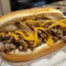 Delicious homemade easy classic Philly Cheesesteak sandwich with melted cheese