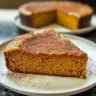 Flourless Pumpkin Spice Greek Yogurt Cake garnished with spices on a plate