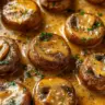 Plate of Garlic Parmesan Mushrooms garnished with herbs