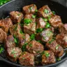 Delicious Garlic Steak Bites served with herbs and spices