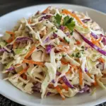Bowl of healthy coleslaw made with fresh vegetables and a light dressing