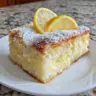 Delicious Lemon Cream Cheese Dump Cake topped with fresh lemon slices